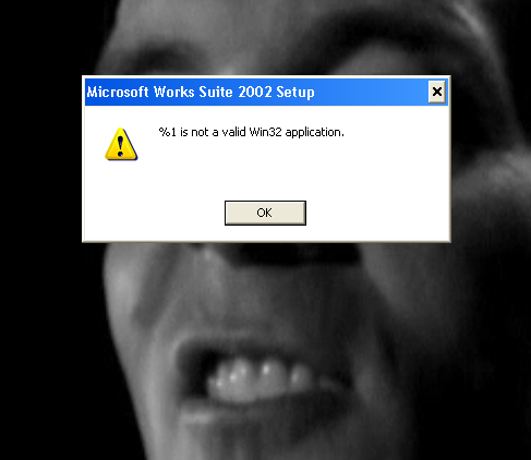 An error message. The image in the background is one I found on the old laptop. It appears to be a screen capture of Tony from P90X taken at an inopportune time. The image was in the background when I took the screen capture and is used here for comedic effect. On a personal note, I try to do 4 P90X videos a week and it has really helped get me in good shape. I propose the US go to a 35 hour work week to accommodate a national fitness program led by President Tony.